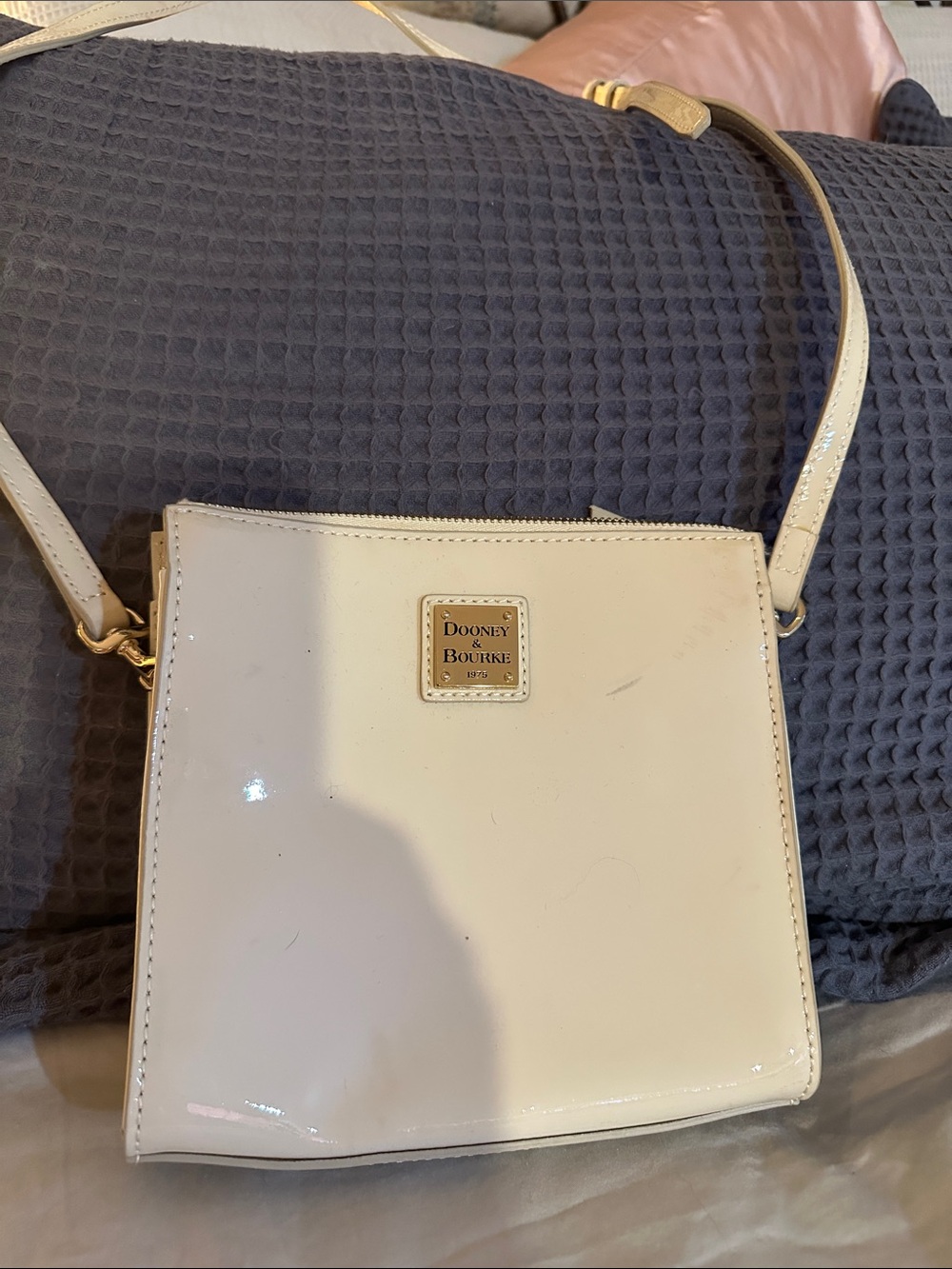 Dooney & Bourke Cream Patent Crossbody with Gold Plaque